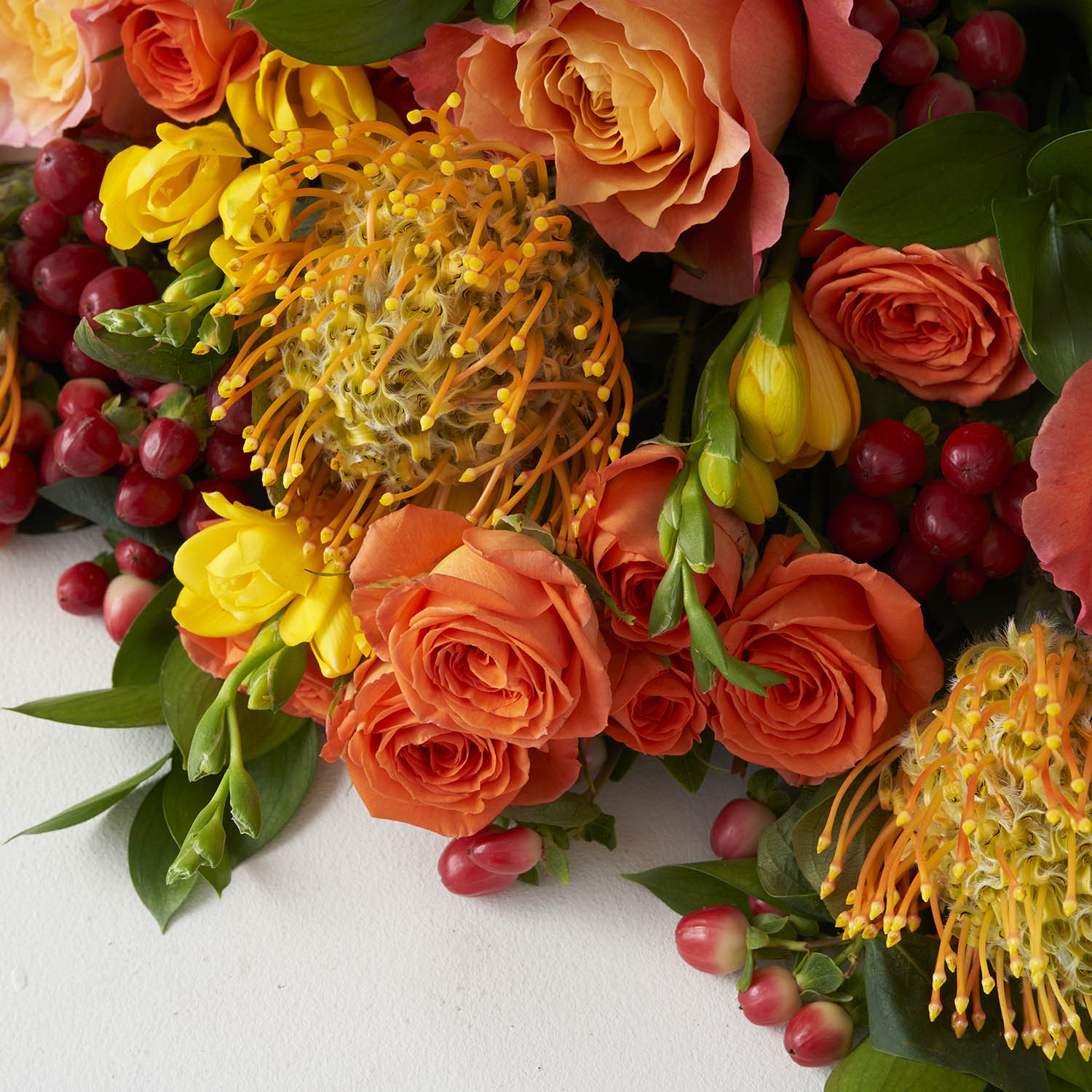 Close up of a citrus coloured bouquet of flowers