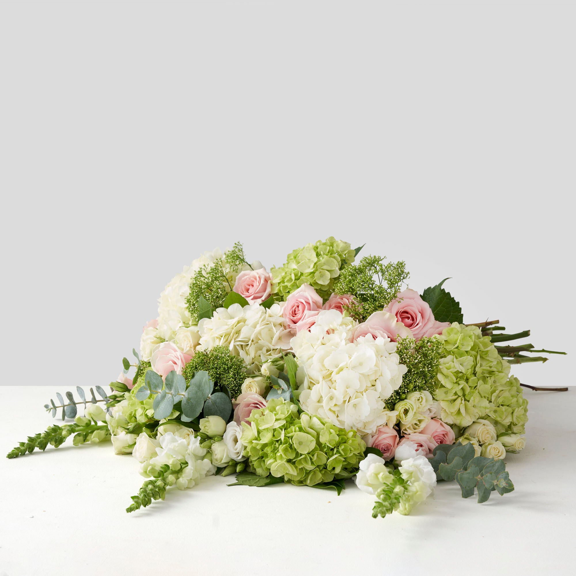 Soft green, white, and pale green flowers.