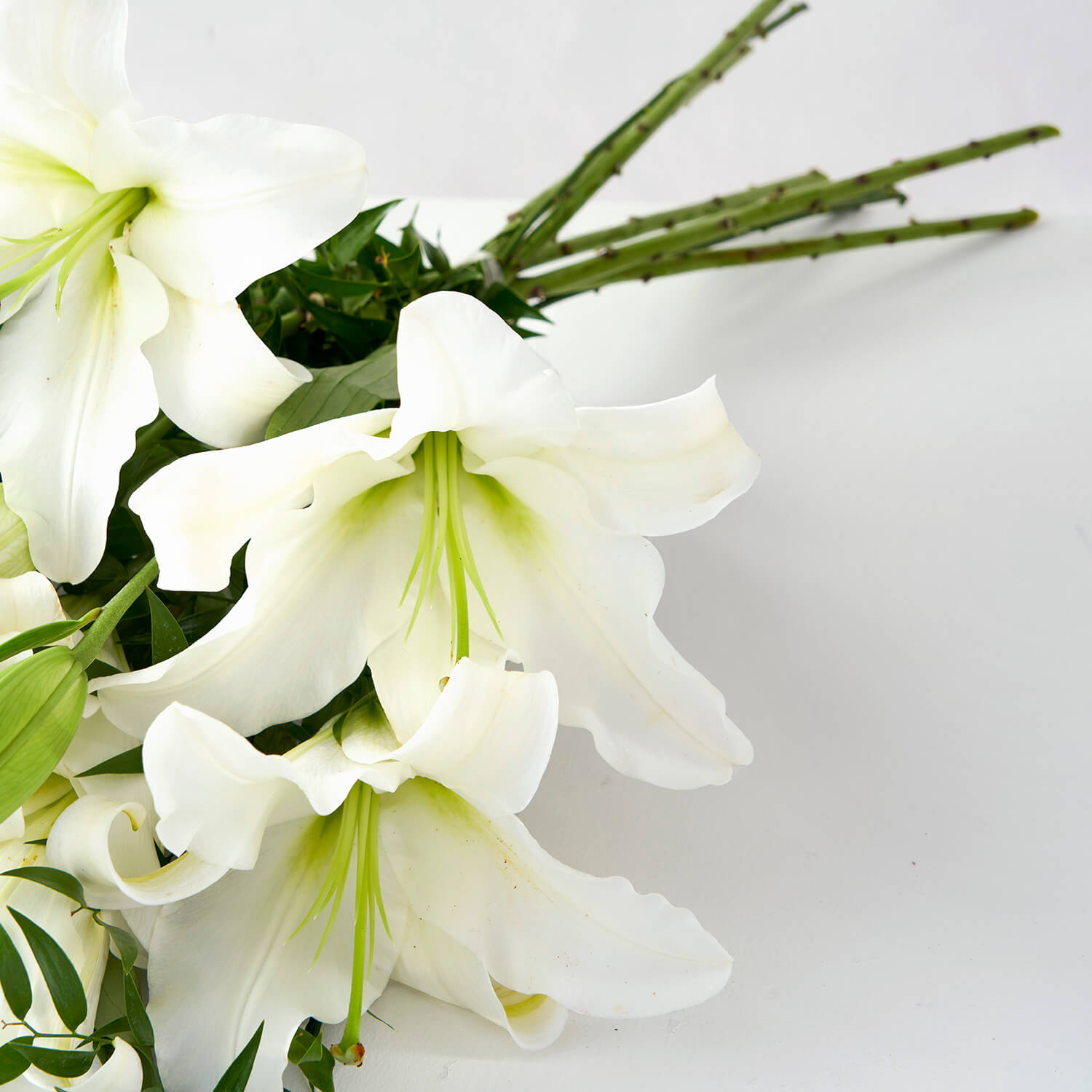 White Lilies with Ruscus