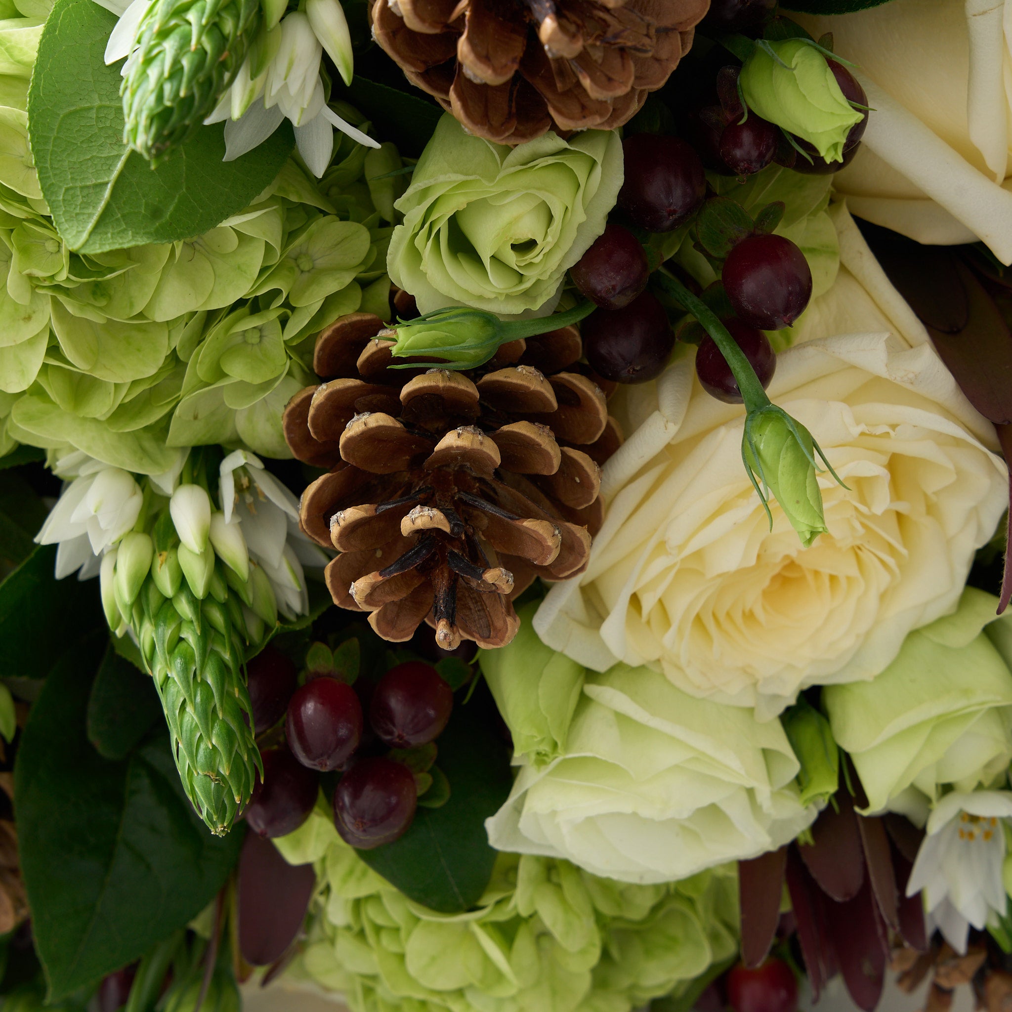 bouquet with white Bethlehem star, white mondial rose, lisianthus, green hydrangea and deep red hypericum