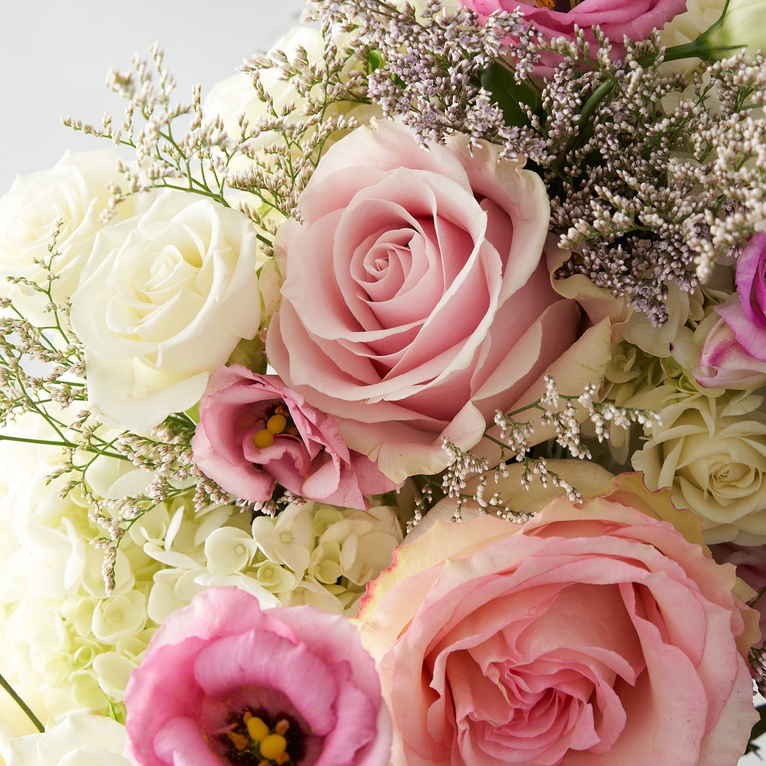 Pink rose with hydrangea and white spray roses