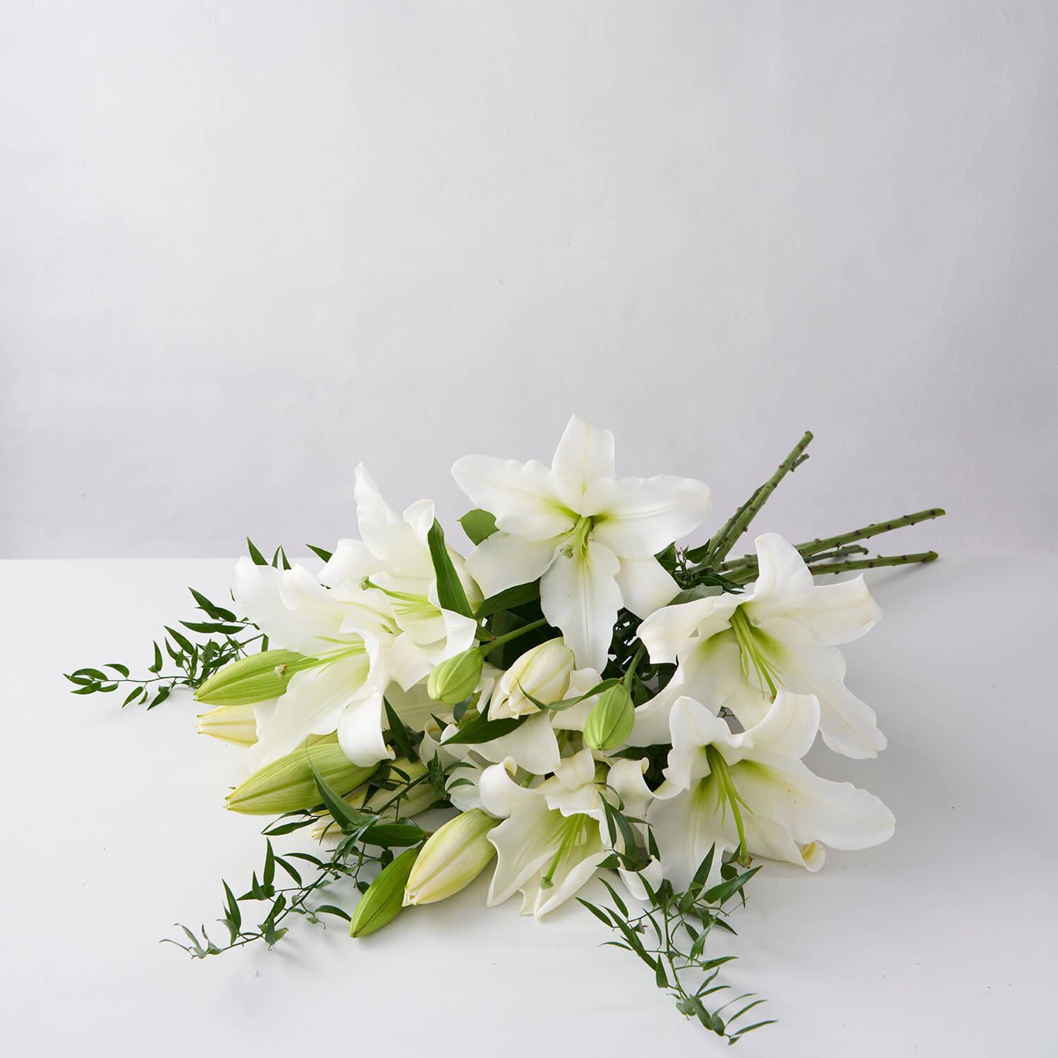 White Lilies with Ruscus